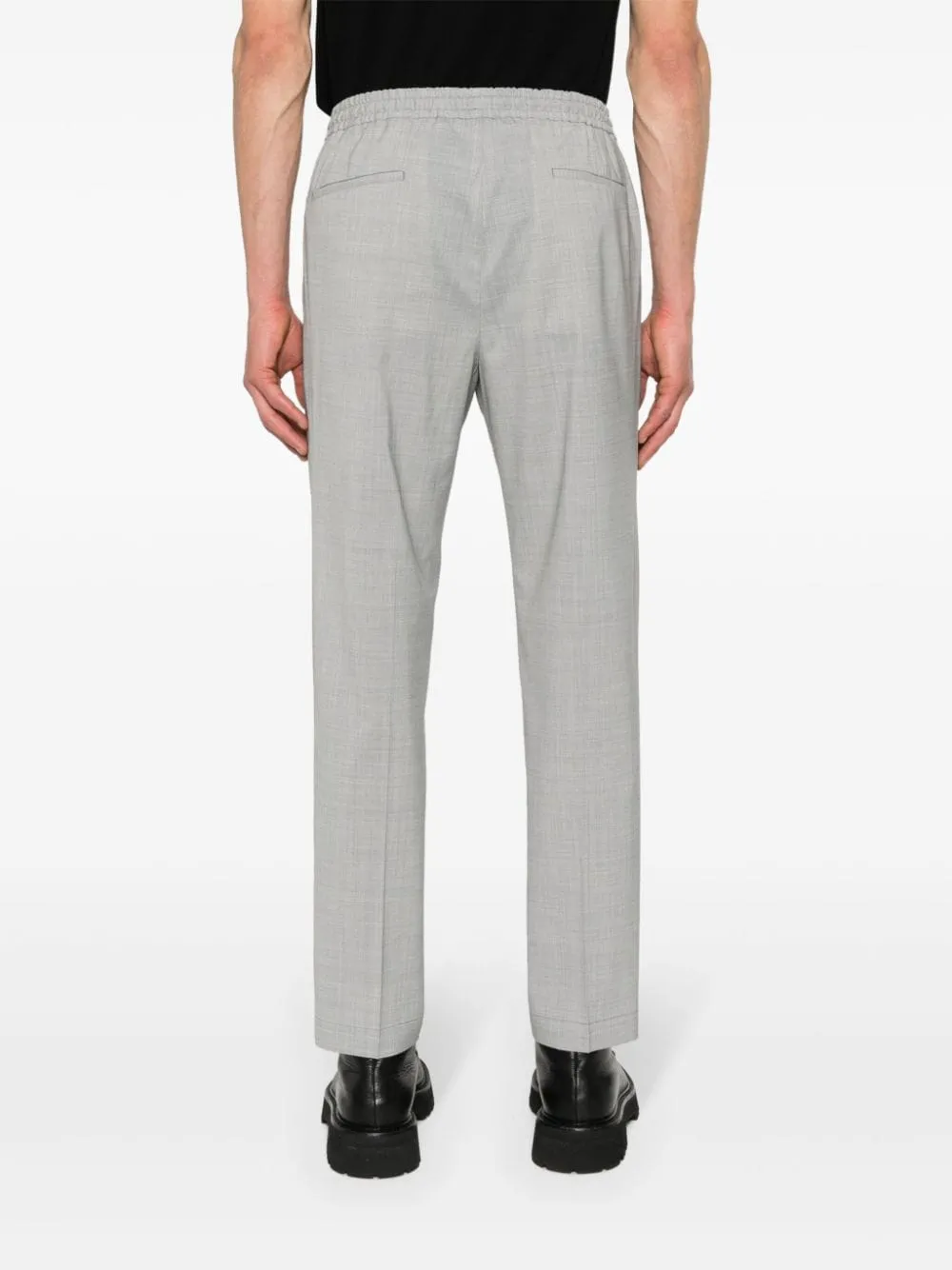 Pantaloni affusolati con pieghe in grigio - uomo